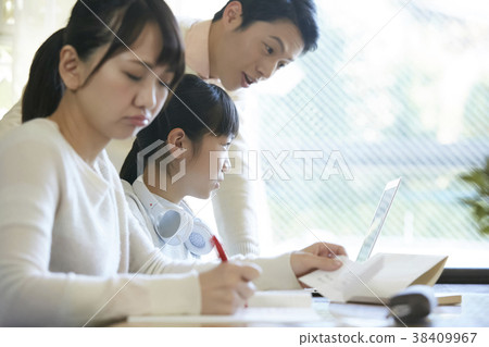 Girl and parents studying Girl and parents studying 38409967