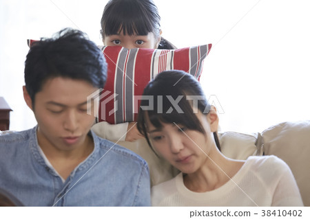 A family relaxing in the living room 38410402
