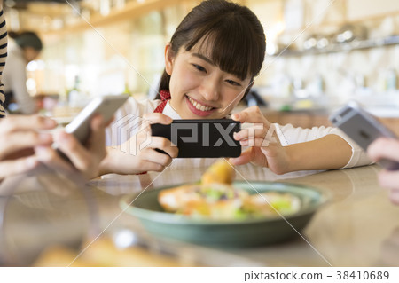 A woman shooting a dish 38410689