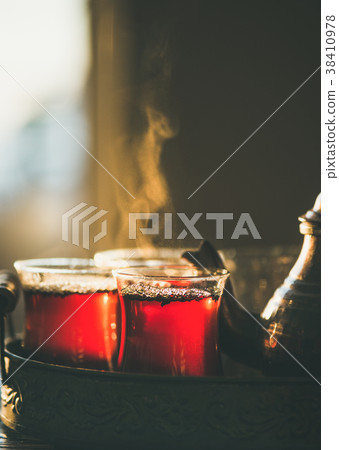 Freshly brewed black tea in turkish glasses 38410978