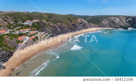 Aerial. Tourists surfers on the beach of Arrifana. 38412109