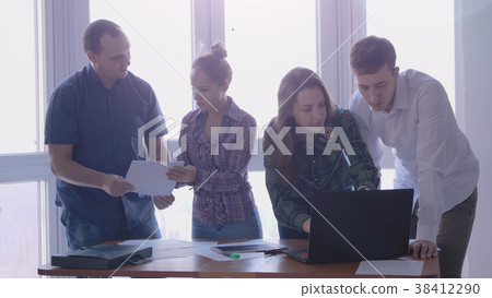 Group of people at the working place in a stylish 38412290