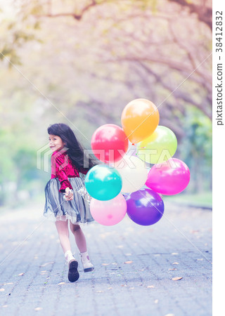 children girl smile and running with balloons children girl smile and running with balloons 38412832