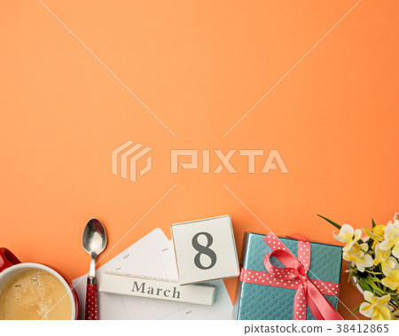The top view of orange desk with cup of coffee The top view of orange desk with cup of coffee 38412865