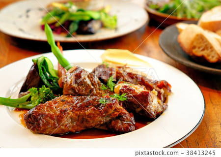 Pork gristle stew in white wine with vegetables Pork gristle stew in white wine with vegetables 38413245