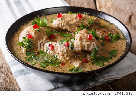 Chicken in spicy walnut sauce and pomegranate Chicken in spicy walnut sauce and pomegranate 38413512