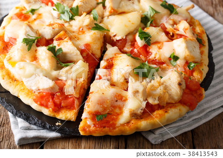 American sliced pizza with chicken, tomatoes American sliced pizza with chicken, tomatoes 38413543