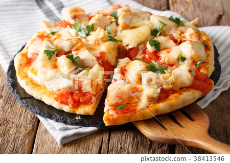 sliced buffalo pizza with chicken, tomato sliced buffalo pizza with chicken, tomato 38413546