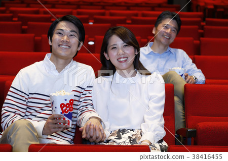 Men and women watching movies 38416455
