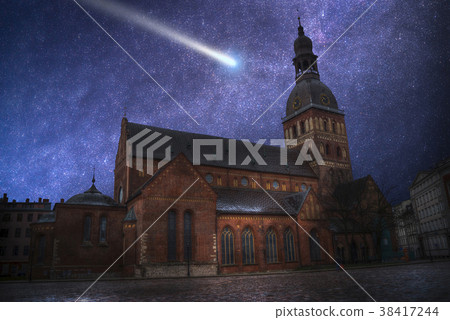 comet flies in the night sky 38417244