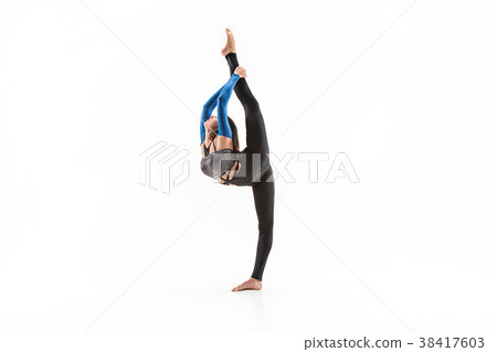 young sporty woman doing acrobatic exercise 38417603