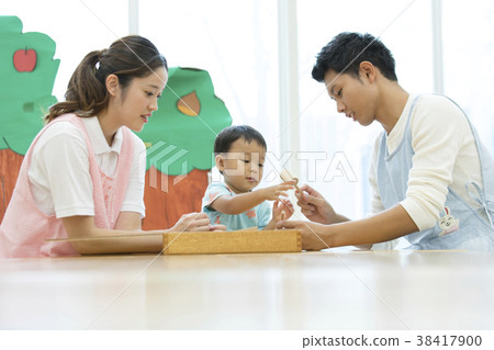 Nursery teacher and a boy Nursery teacher and a boy 38417900