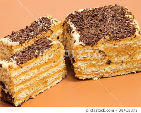 biscuit Swiss roll isolated on brown background 38418372