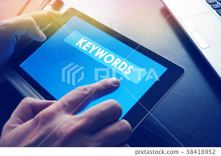 Word Keywords on a tablet as a part of SEO. 38418952