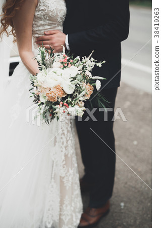 Beauty wedding bouquet with different flowers in 38419263