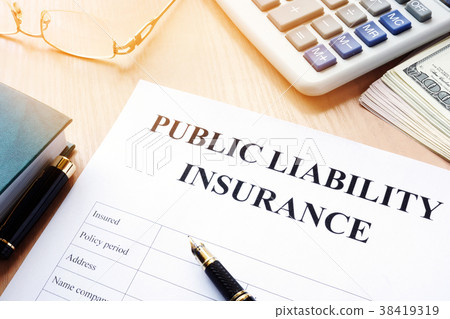 Public liability insurance policy on  desk. 38419319