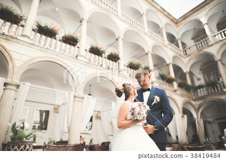 Perfect couple bride, groom posing and kissing in Perfect couple bride, groom posing and kissing in 38419484