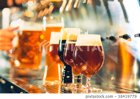 Beer taps in a pub Beer taps in a pub 38419779