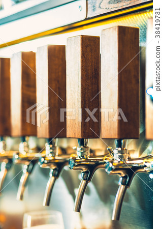 Beer taps in a pub Beer taps in a pub 38419781