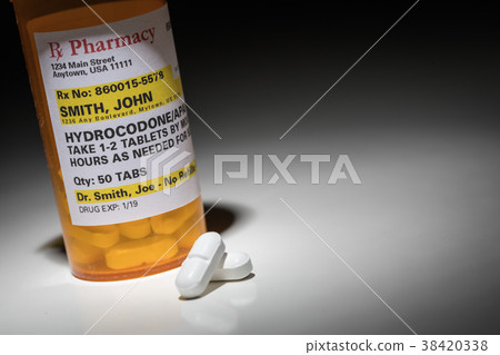Hydrocodone Pills and Prescription Bottle  38420338