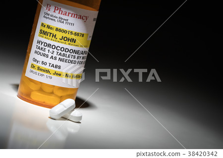 Hydrocodone Pills and Prescription Bottle  38420342