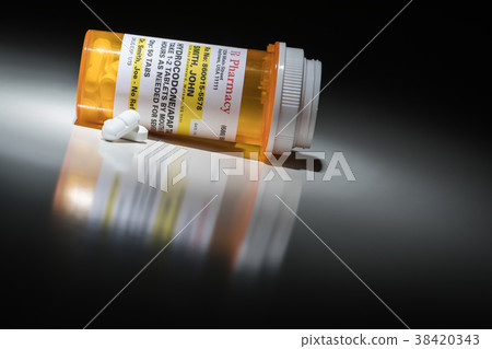 Hydrocodone Pills and Prescription Bottle  38420343