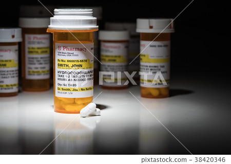 Hydrocodone Pills and Prescription Bottle  38420346