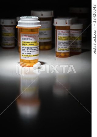 Hydrocodone Pills and Prescription Bottle  38420348