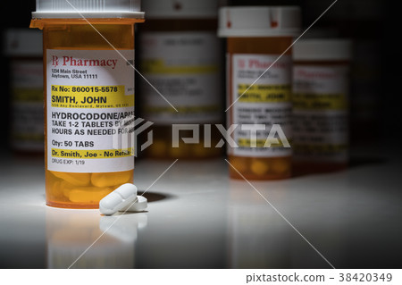 Hydrocodone Pills and Prescription Bottle  38420349