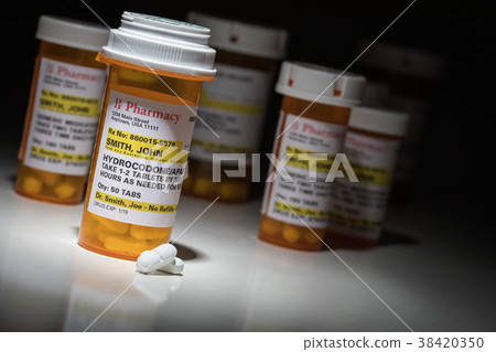 Hydrocodone Pills and Prescription Bottle  38420350
