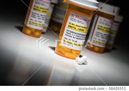 Hydrocodone Pills and Prescription Bottle  38420351