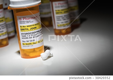 Hydrocodone Pills and Prescription Bottle  38420352
