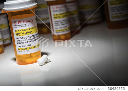 Hydrocodone Pills and Prescription Bottle  38420353