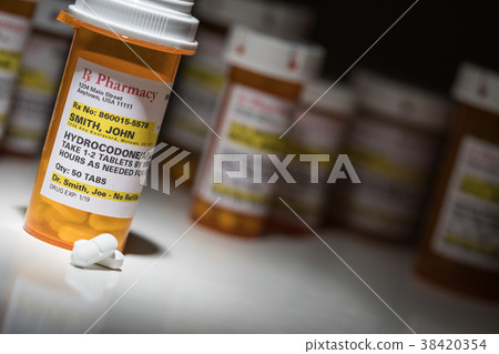 Hydrocodone Pills and Prescription Bottle  38420354