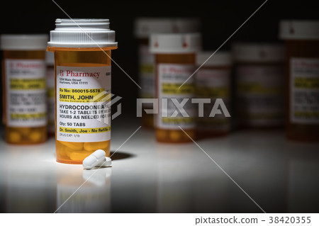 Hydrocodone Pills and Prescription Bottle  38420355