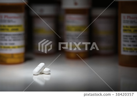 Hydrocodone Pills and Prescription Bottle  38420357