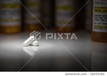 Hydrocodone Pills and Prescription Bottle  38420360