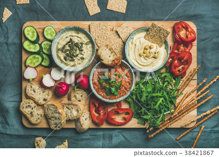 Flat-lay of Vegetarian dips hummus, babaganush Flat-lay of Vegetarian dips hummus, babaganush 38421867