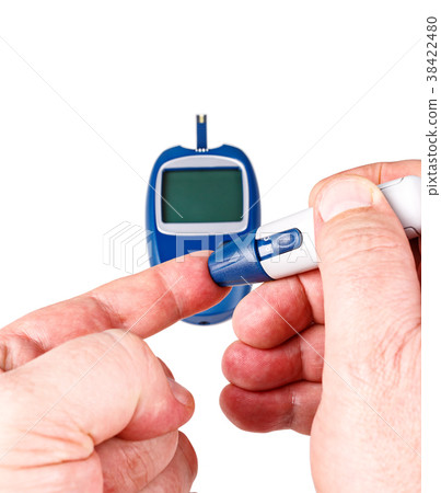 Man use a blood glucose meter 38422480