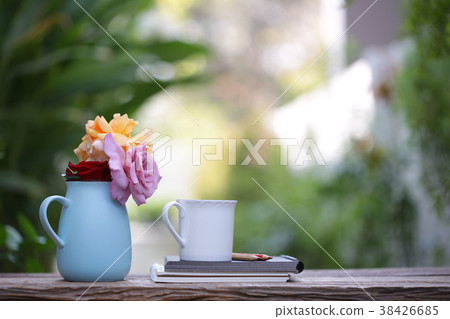 Colorful Roses in blue pot with notebook Colorful Roses in blue pot with notebook 38426685