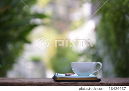 white cup and diary note white cup and diary note 38426687