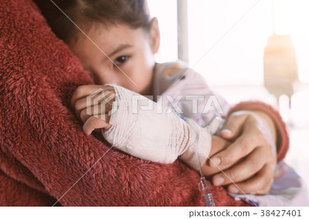 Sick asian little child girl hugging her mother 38427401