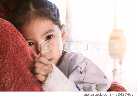 Sick asian little child girl hugging her mother 38427402