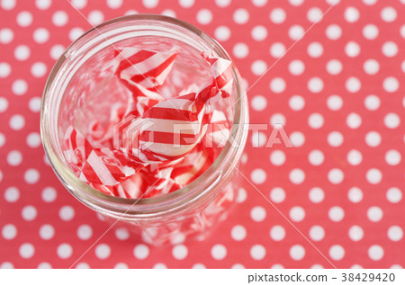 Candy in a glass bottle 38429420