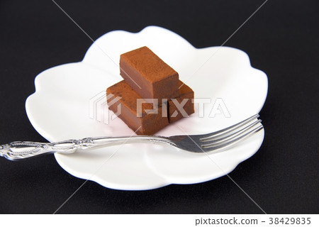 Raw chocolate image (with fork, black background) 38429835