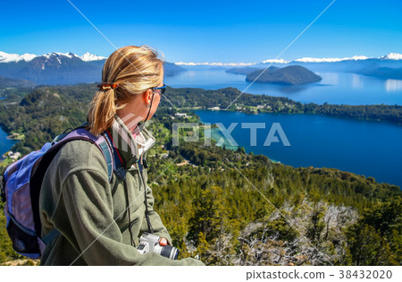 Girl admiring the beauty of argentinian Lake District 38432020