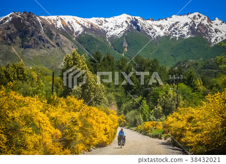 Woman cycling in argentinian Lake District 38432021