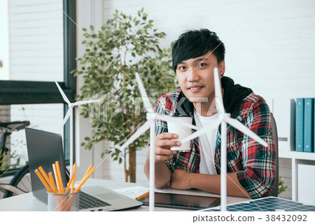 alternative energy designer drinking coffee 38432092