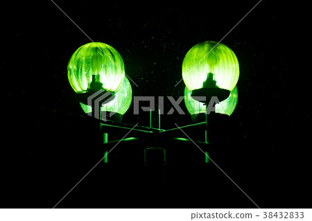 Lantern, burning green light, in the dark 38432833