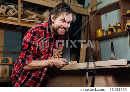 carpenter man's hand treats the tree, cuts the carpenter man's hand treats the tree, cuts the 38433283